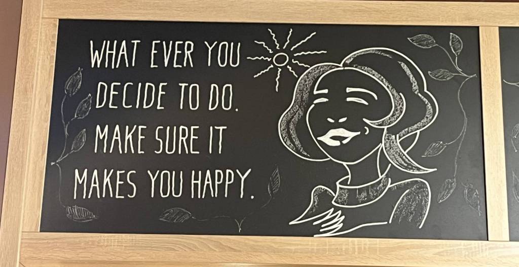 Chalkboard with text whatever you decide to do, make sure it makes you happy.