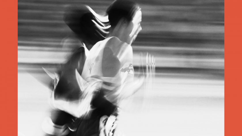 A blurred image of a woman running in athletic gear, symbolising the body’s instinct to flee from perceived danger.