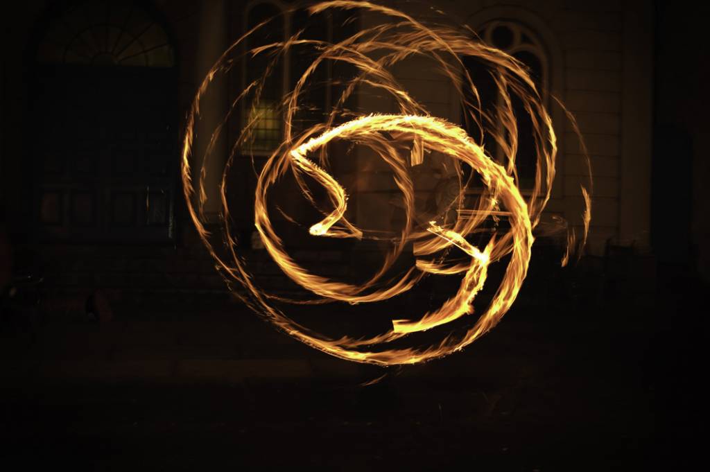 A circular pattern of flaming torches during a winter solstice celebration