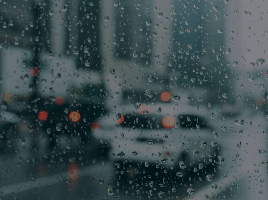 Rainy busy street of traffic representing winter days and small moments of presence.