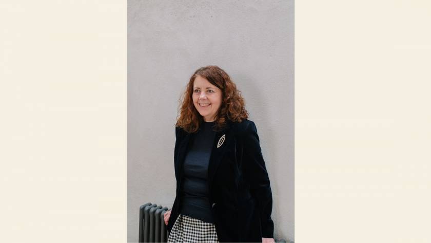 Karen Toms, therapist and counsellor, smiling warmly, reflecting the role of humour and lightness in therapy