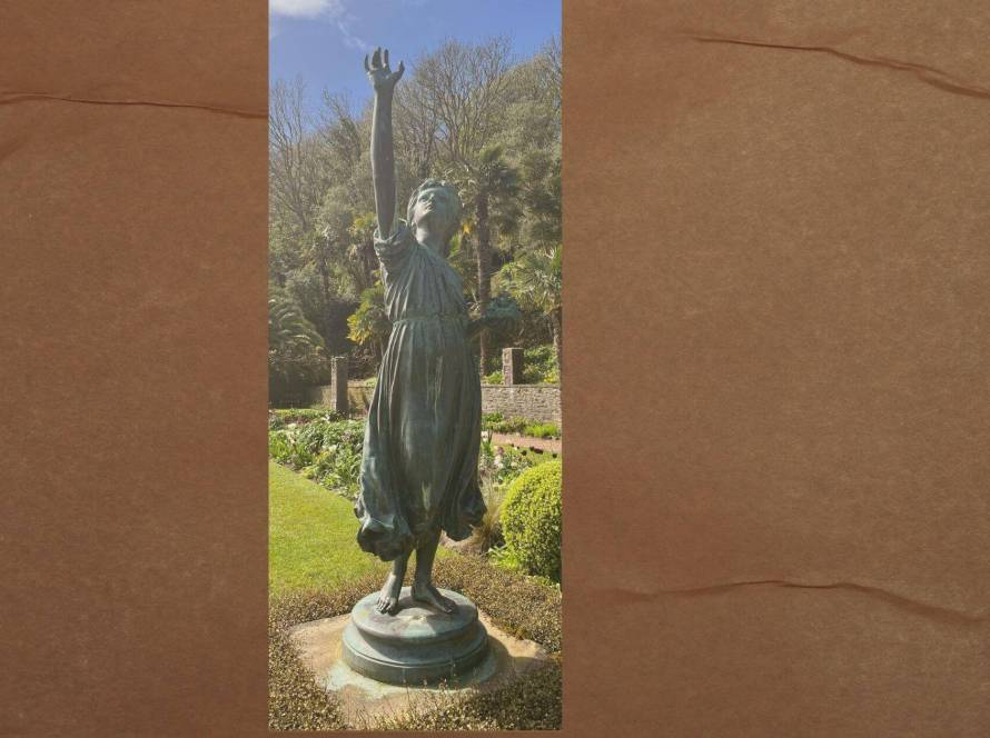 Bronze statue of a figure reaching upward in a sunlit garden, representing the feeling of striving to move forward despite something holding you back