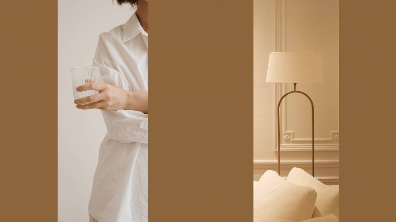 A woman holding a glass alongside a warm interior with a brass lamp — exploring the body as home, by Karen Toms therapist and counsellor